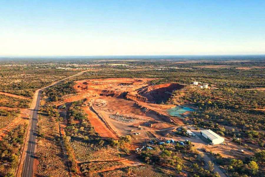 Open pit copper mine with town in background